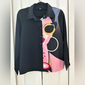 Woman’s long sleeved button down shirt size small color black